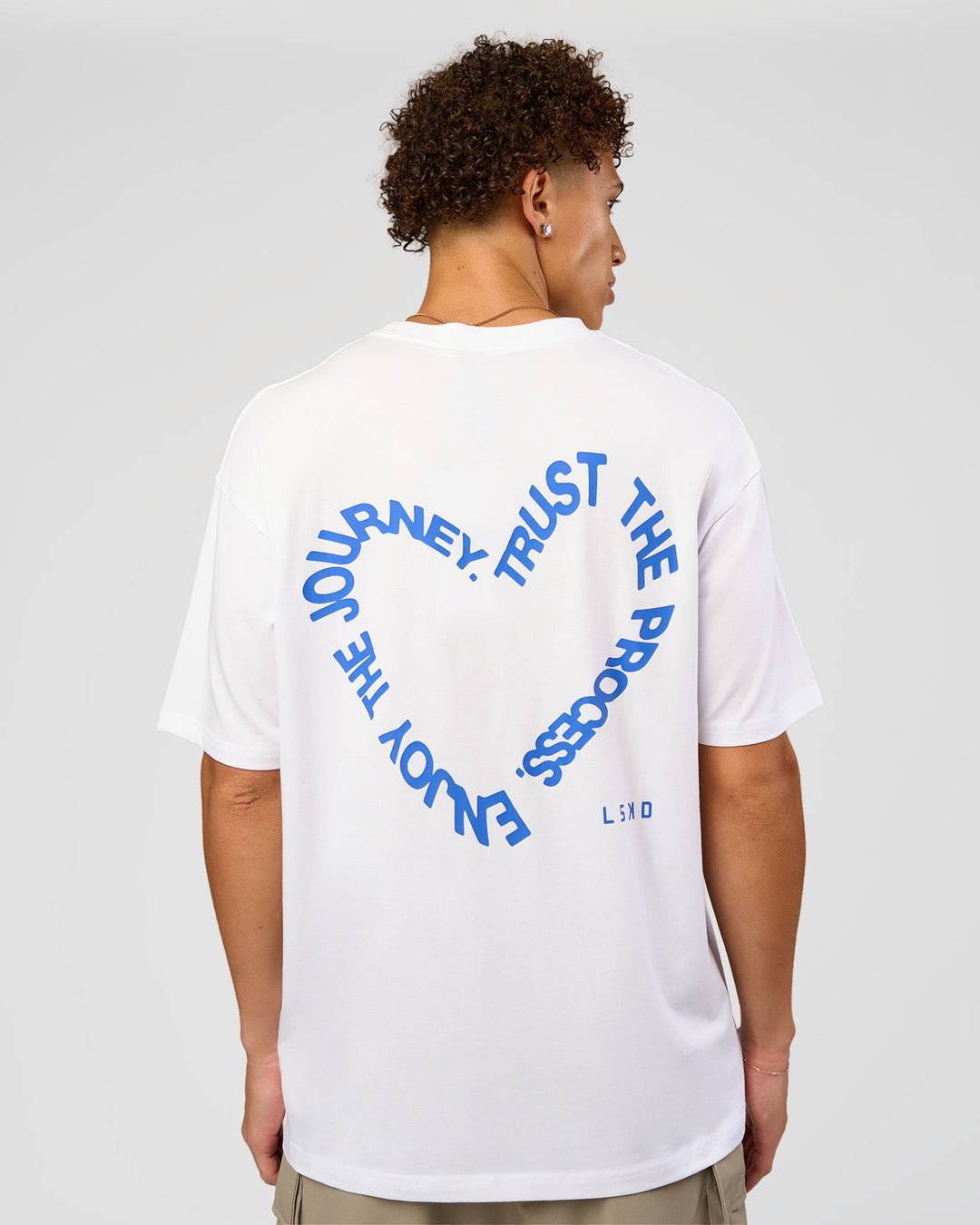 Man wearing Love The Process FLXCotton Oversize Tee - White-Electric Indigo | Model:Leandro | Size:M - view 2