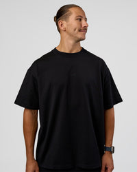 Man wearing MVP 2.0 Oversized Tee - Black | Model:Jaiden | Size:M