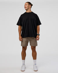 Man wearing MVP 2.0 Oversized Tee - Black | Model:Jaiden | Size:M