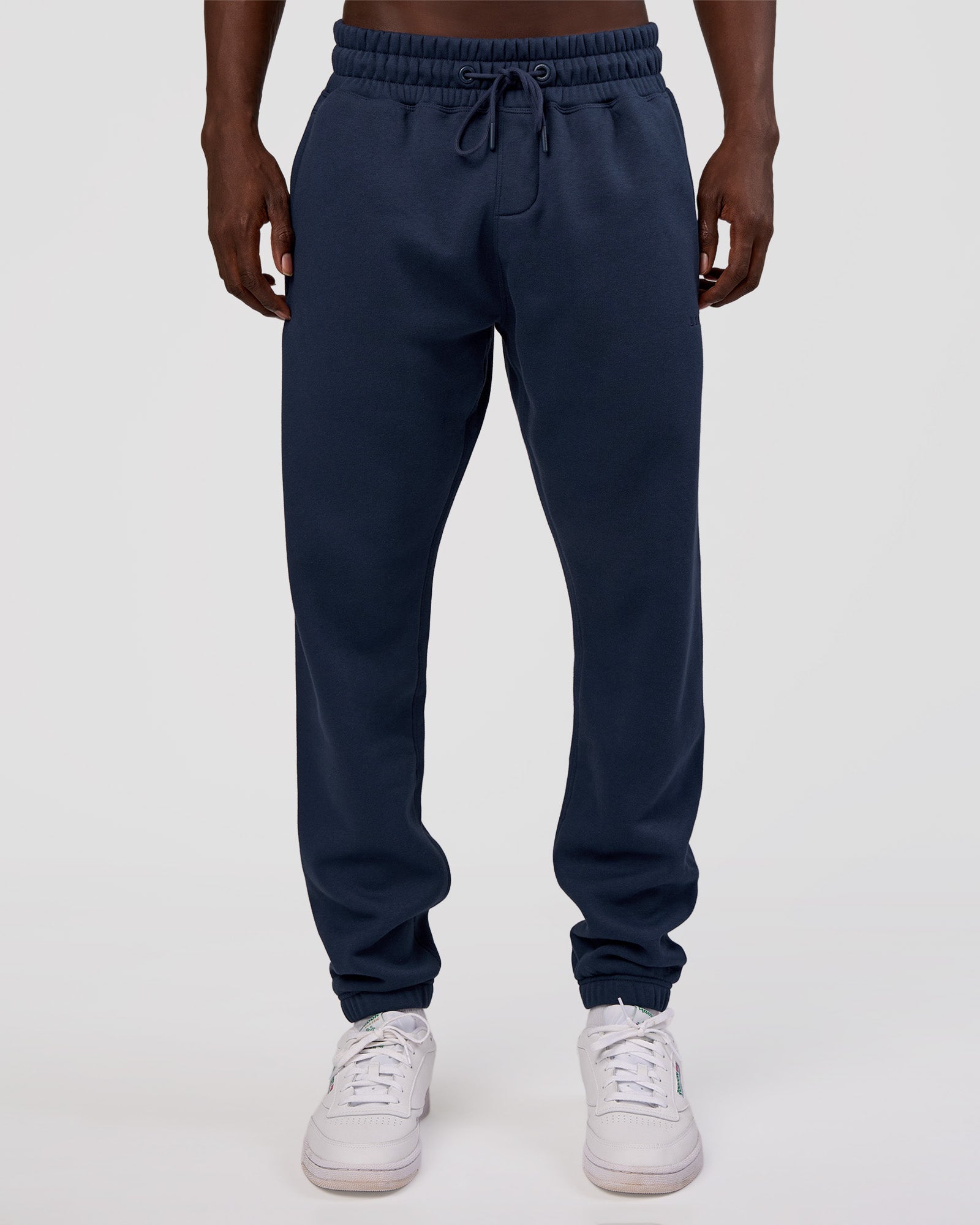 Man wearing MVP Cuffed Track Pant - Future Navy | Model:Okello | Size:M