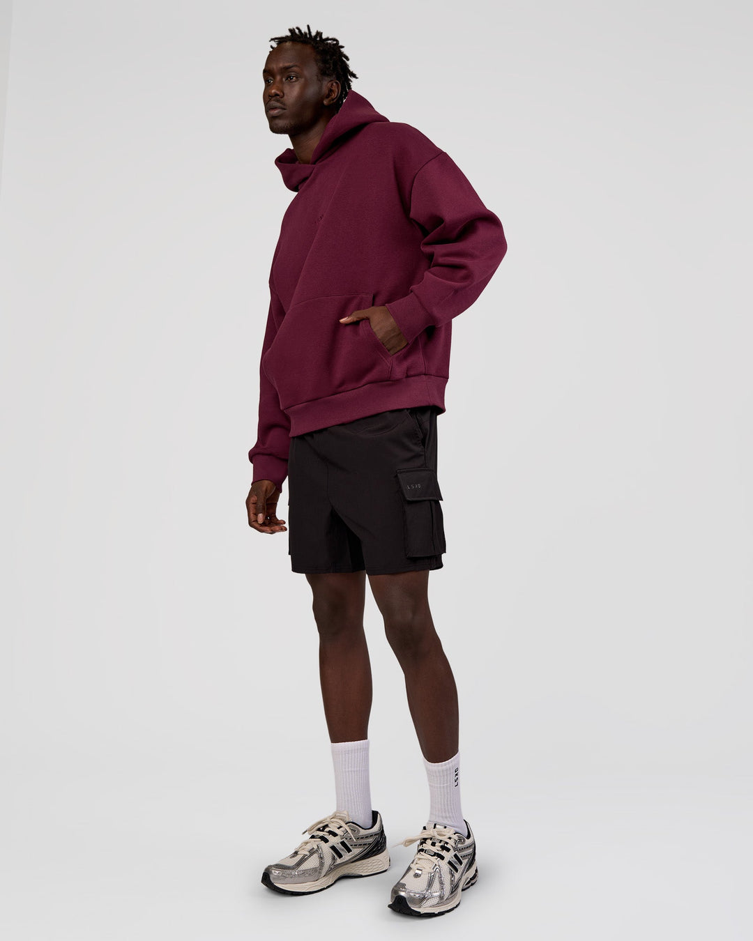 Man wearing MVP Oversized Hoodie - Cherry Lacquer | Model:Okello | Size:M