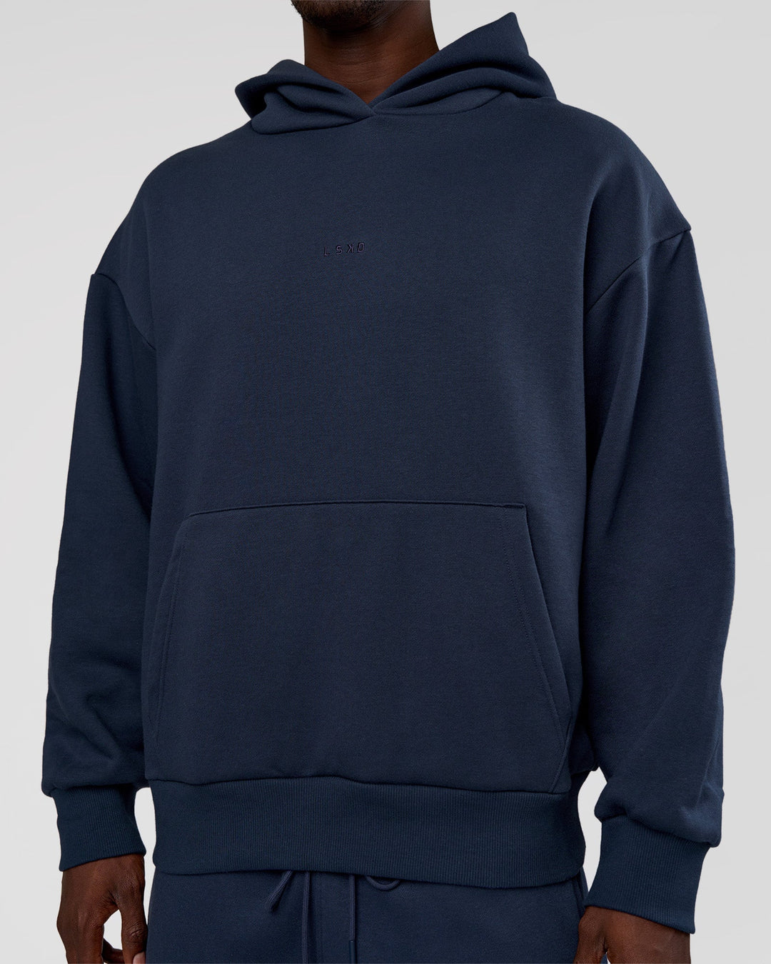 Man wearing MVP Oversized Hoodie - Future Navy | Model:Okello | Size:M
