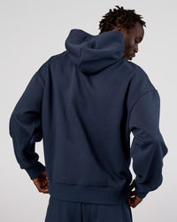Man wearing MVP Oversized Hoodie - Future Navy | Model:Okello | Size:M