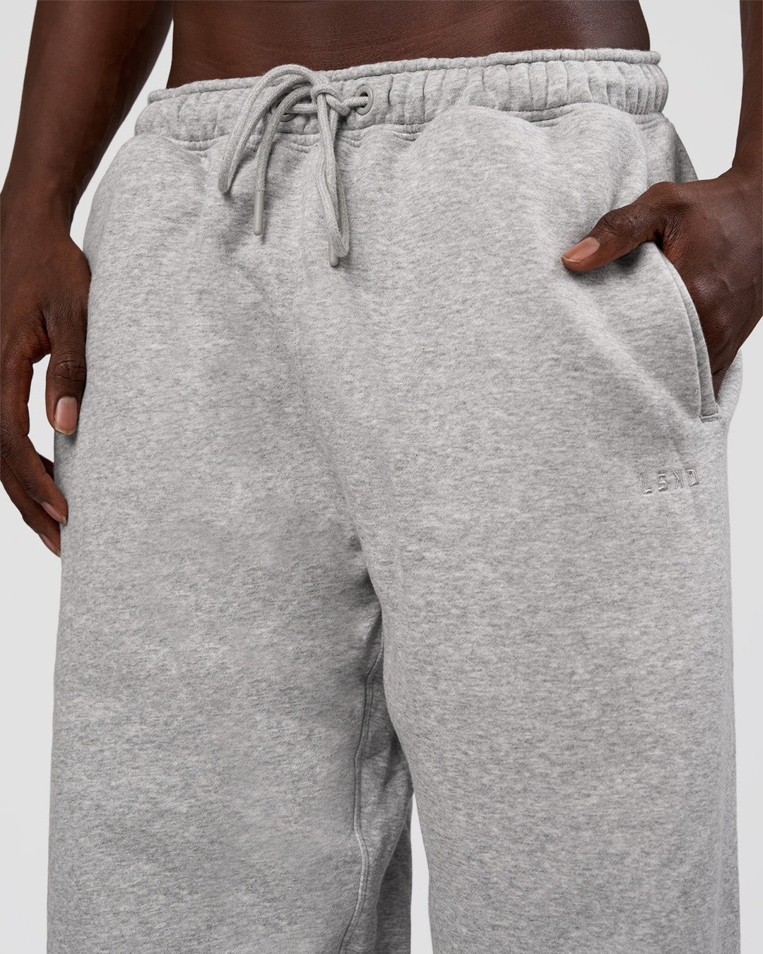 Man wearing MVP Straight Leg Pant - Light Grey Marl | Model:Okello | Size:M