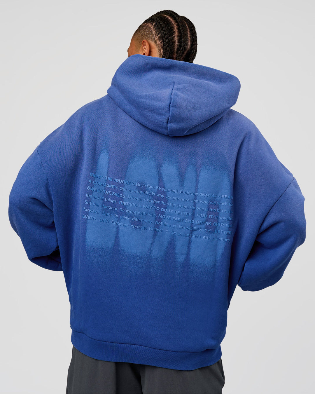 Man wearing Memory In Motion Ultra Heavyweight Washed Hoodie - Electric Indigo Washed | Model:Malebo | Size:M
