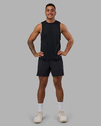 Man wearing AeroFLX+ Seamless Muscle Tank - Black Marl | Model:Daarian | Size:M