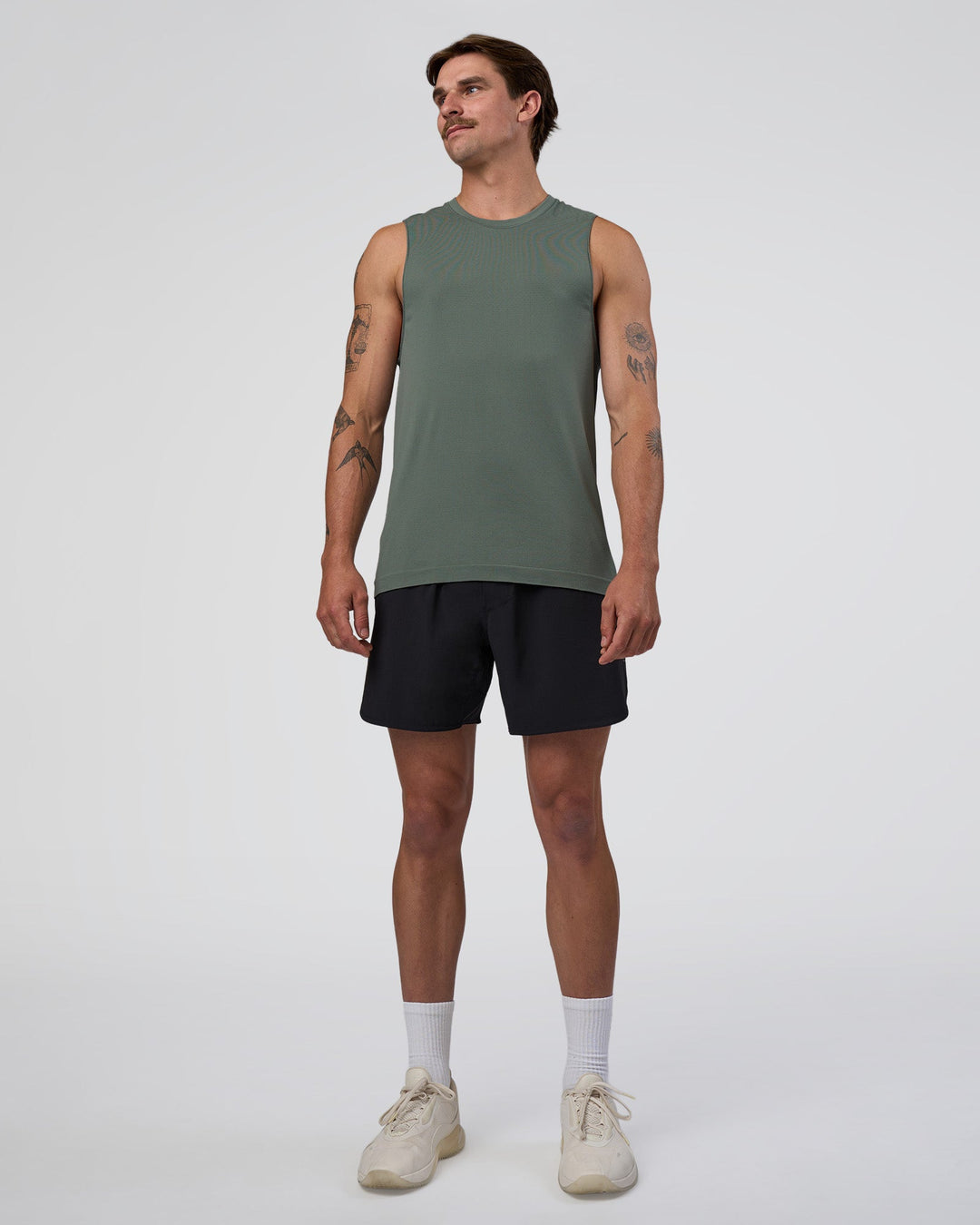 Man wearing AeroFLX+ Seamless Muscle Tank - Graphite/Graphite | Model:Konnor | Size:M