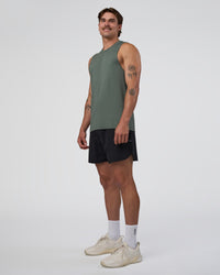 Man wearing AeroFLX+ Seamless Muscle Tank - Graphite/Graphite | Model:Konnor | Size:M