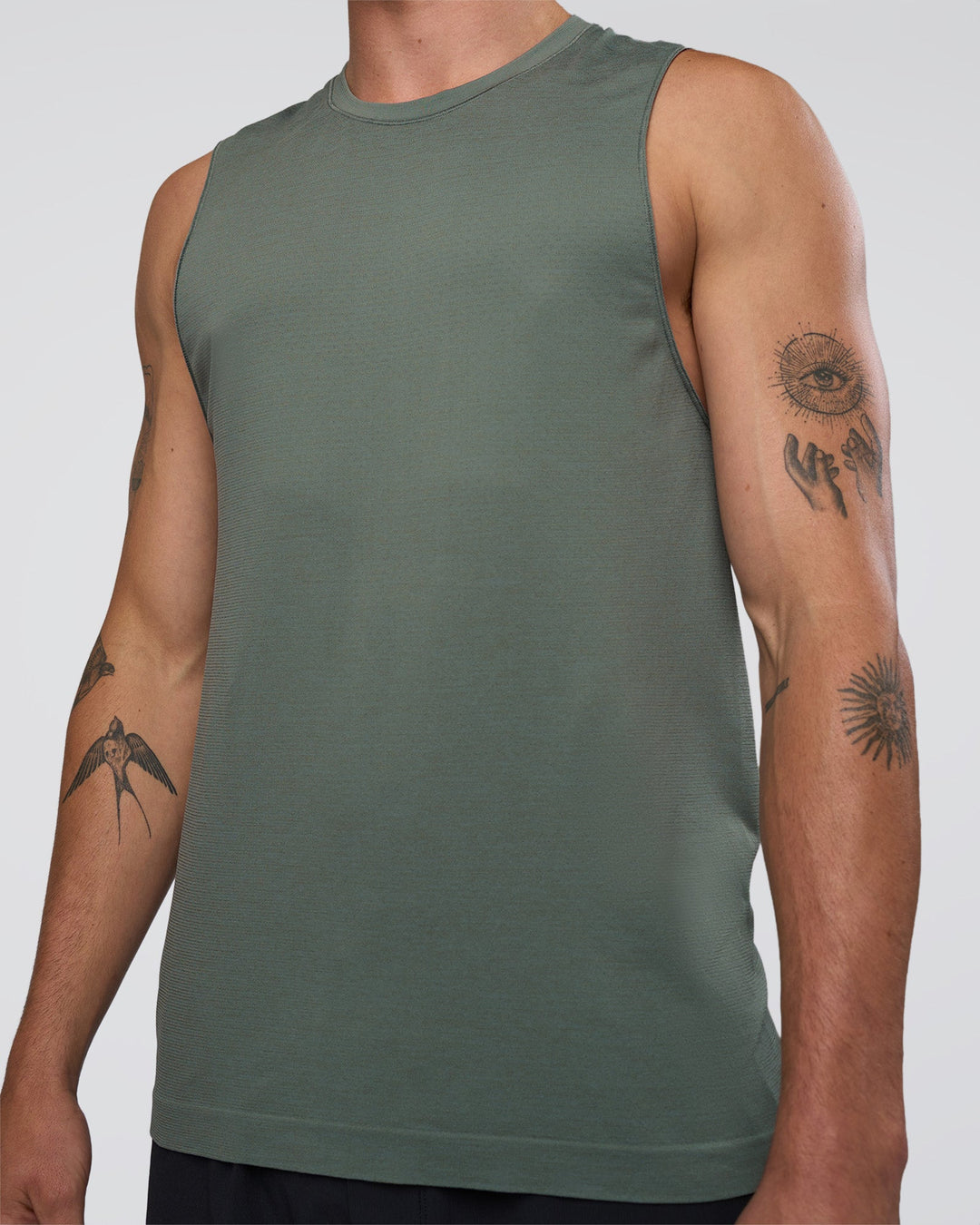 Man wearing AeroFLX+ Seamless Muscle Tank - Graphite/Graphite | Model:Konnor | Size:M
