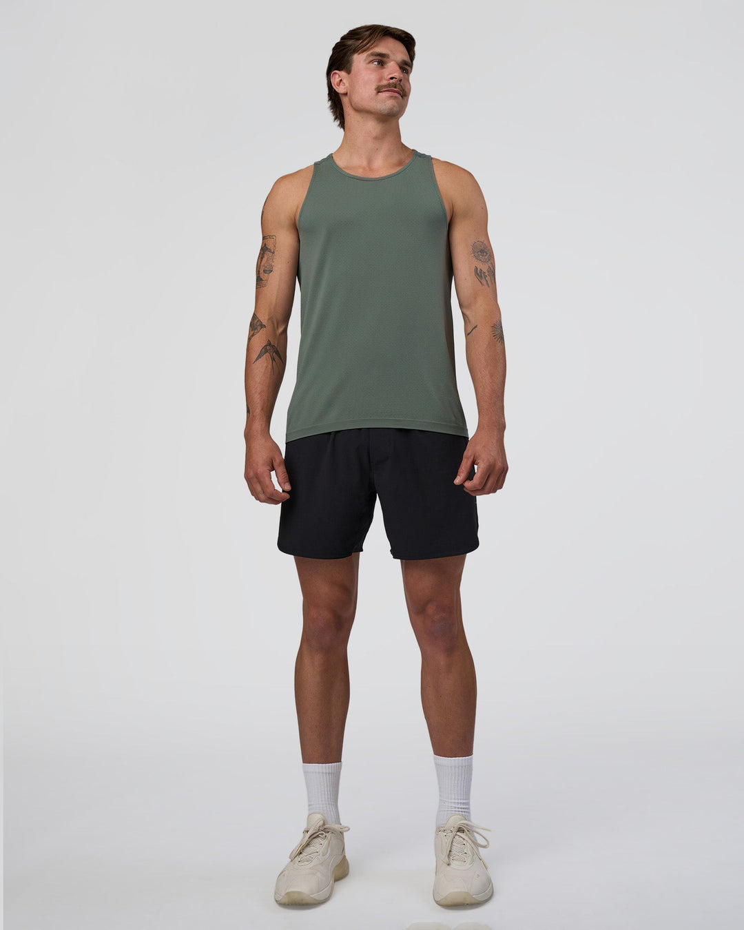 Man wearing AeroFLX+ Seamless Tank - Graphite/Graphite | Model:Konnor | Size:M