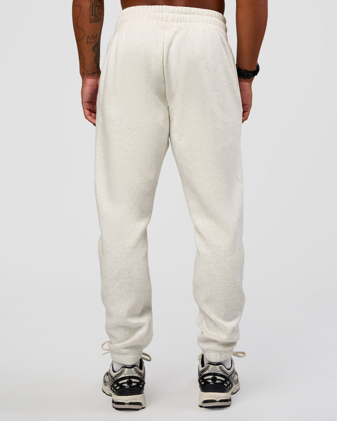 Man wearing MVP Cuffed Track Pant - Silver Marl | Model:Malebo | Size:M