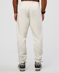 Man wearing MVP Cuffed Track Pant - Silver Marl | Model:Malebo | Size:M