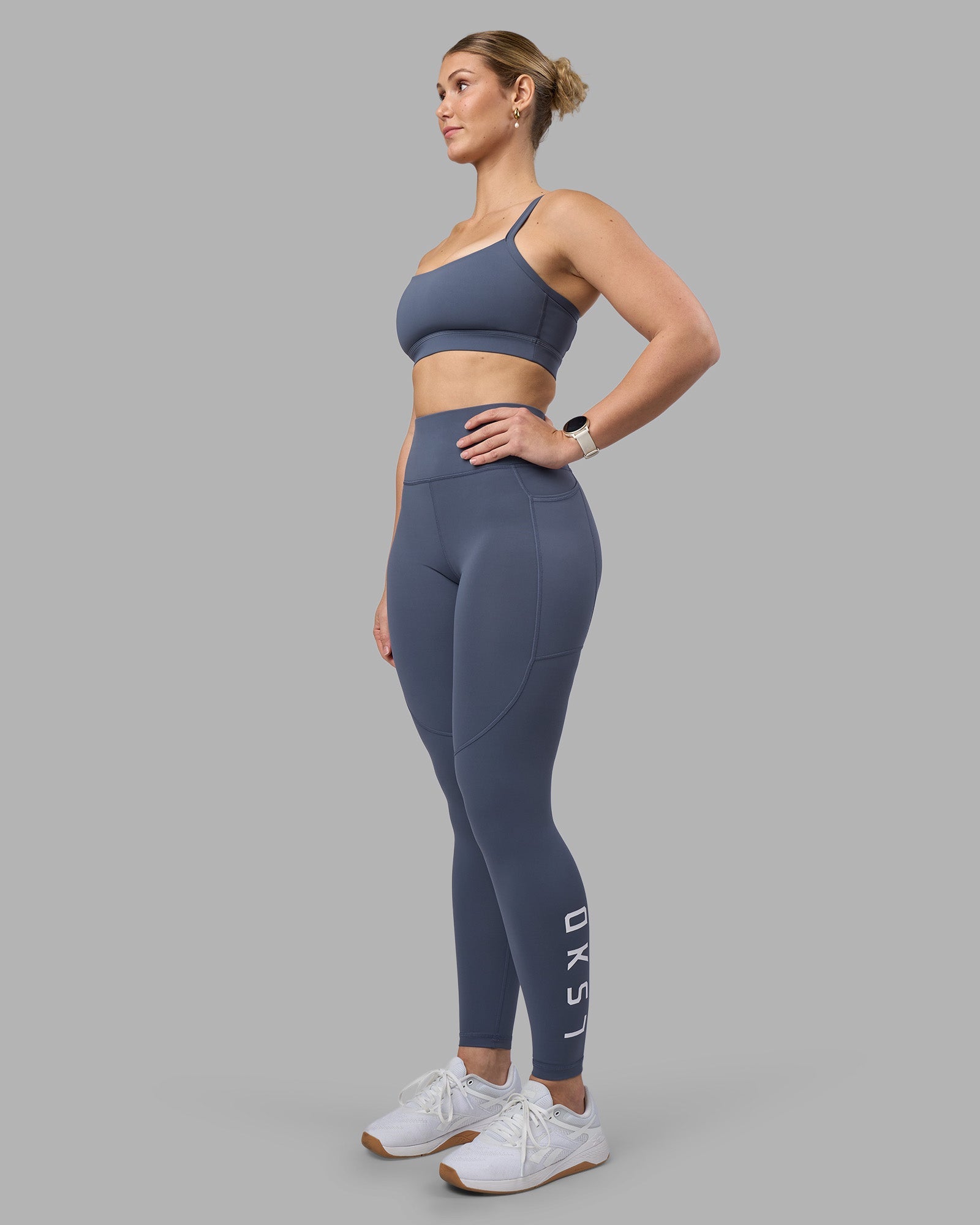 Woman wearing Momentum Sports Bra D/DD/E - Night Shadow | Model:Amy | Size:M