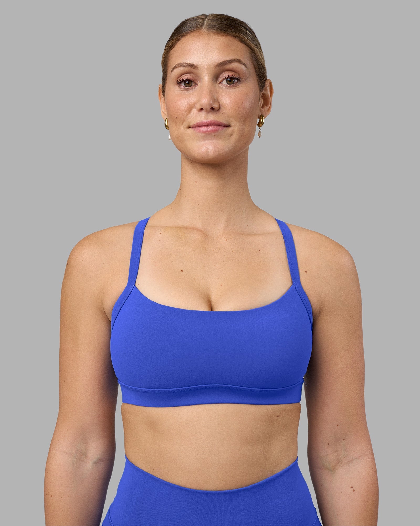 Woman wearing Momentum Sports Bra - Power Cobalt | Model:Amy | Size:M