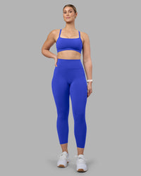 Woman wearing Momentum Sports Bra - Power Cobalt | Model:Amy | Size:M