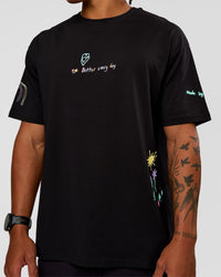 Man wearing Mother's Day FLXCotton Oversize Tee - Black | Model:Malebo | Size:M