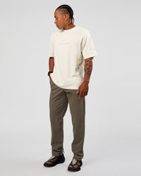 Man wearing Mother's Day FLXCotton Oversize Tee - Off White | Model:Malebo | Size:M