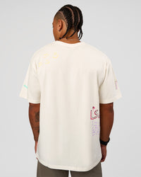 Man wearing Mother's Day FLXCotton Oversize Tee - Off White | Model:Malebo | Size:M