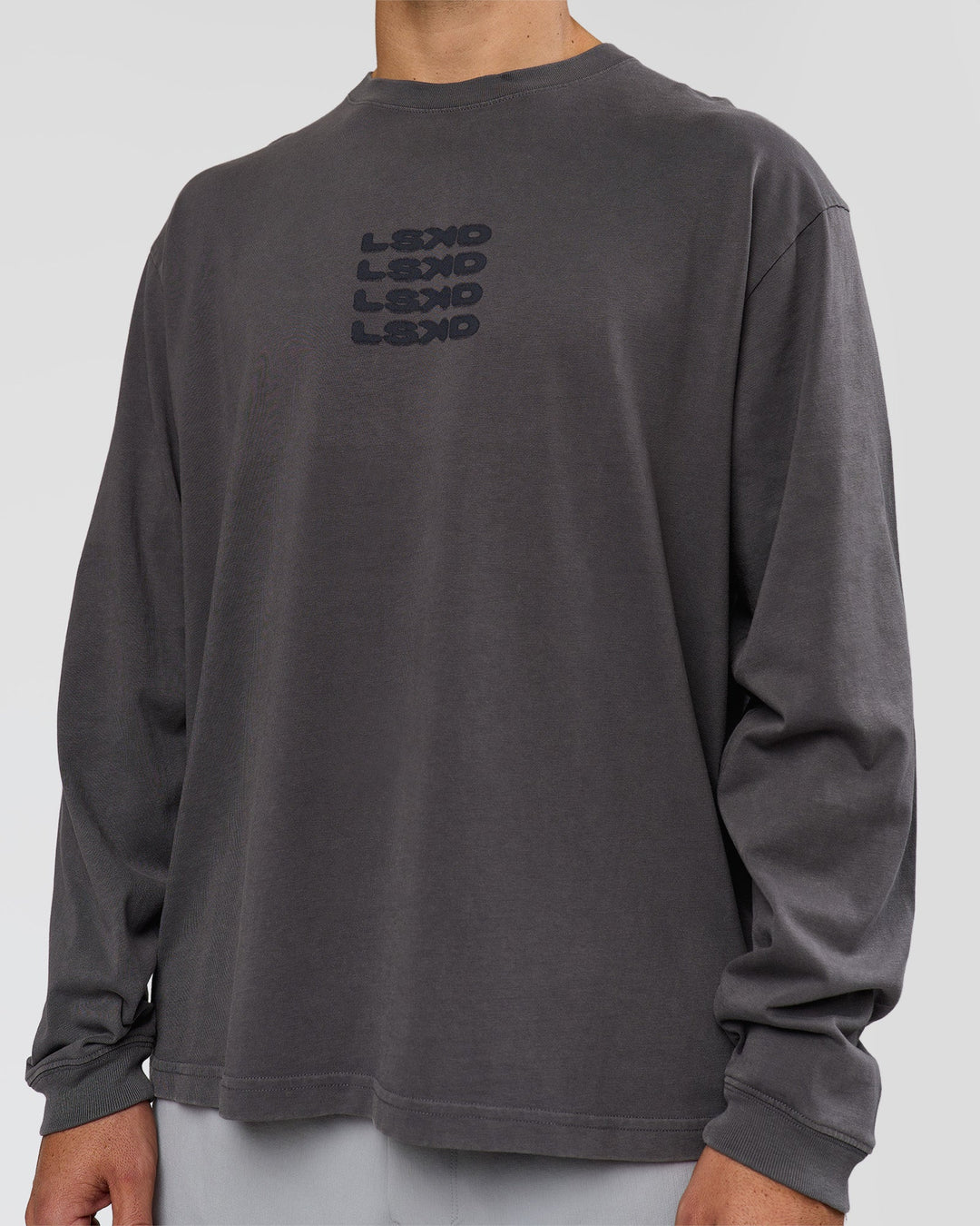Man wearing Move Fast Heavyweight Oversized Long Sleeve Tee - Dark Storm Washed | Model:Jaiden | Size:M