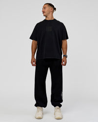 Man wearing Move Fast Heavyweight Oversized Tee - Black Washed | Model:Jaiden | Size:M