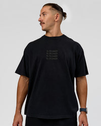 Man wearing Move Fast Heavyweight Oversized Tee - Black Washed | Model:Jaiden | Size:M