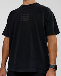 Man wearing Move Fast Heavyweight Oversized Tee - Black Washed | Model:Jaiden | Size:M