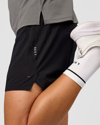 Man wearing Pace 5" Lined Ripstop Short - Black | Model:Liam | Size:M |
