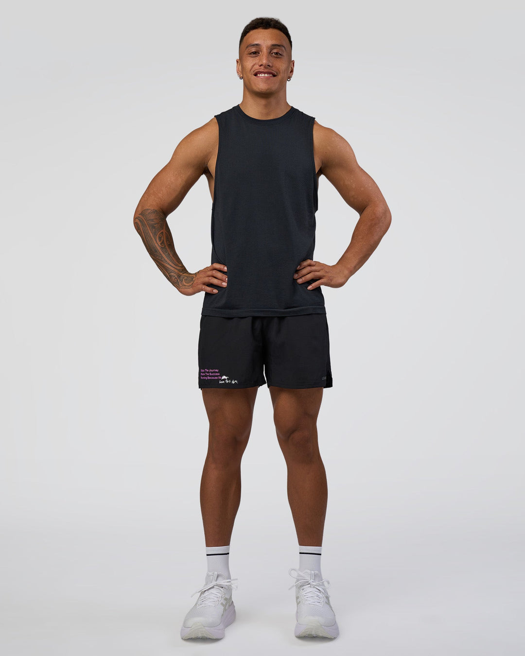 Man wearing Pace 5" Lined Running Short - Black-Ultra Fuchsia | Model:Daarian | Size:M