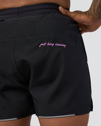 Man wearing Pace 5" Lined Running Short - Black-Ultra Fuchsia | Model:Daarian | Size:M