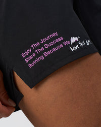 Man wearing Pace 5" Lined Running Short - Black-Ultra Fuchsia | Model:Daarian | Size:M