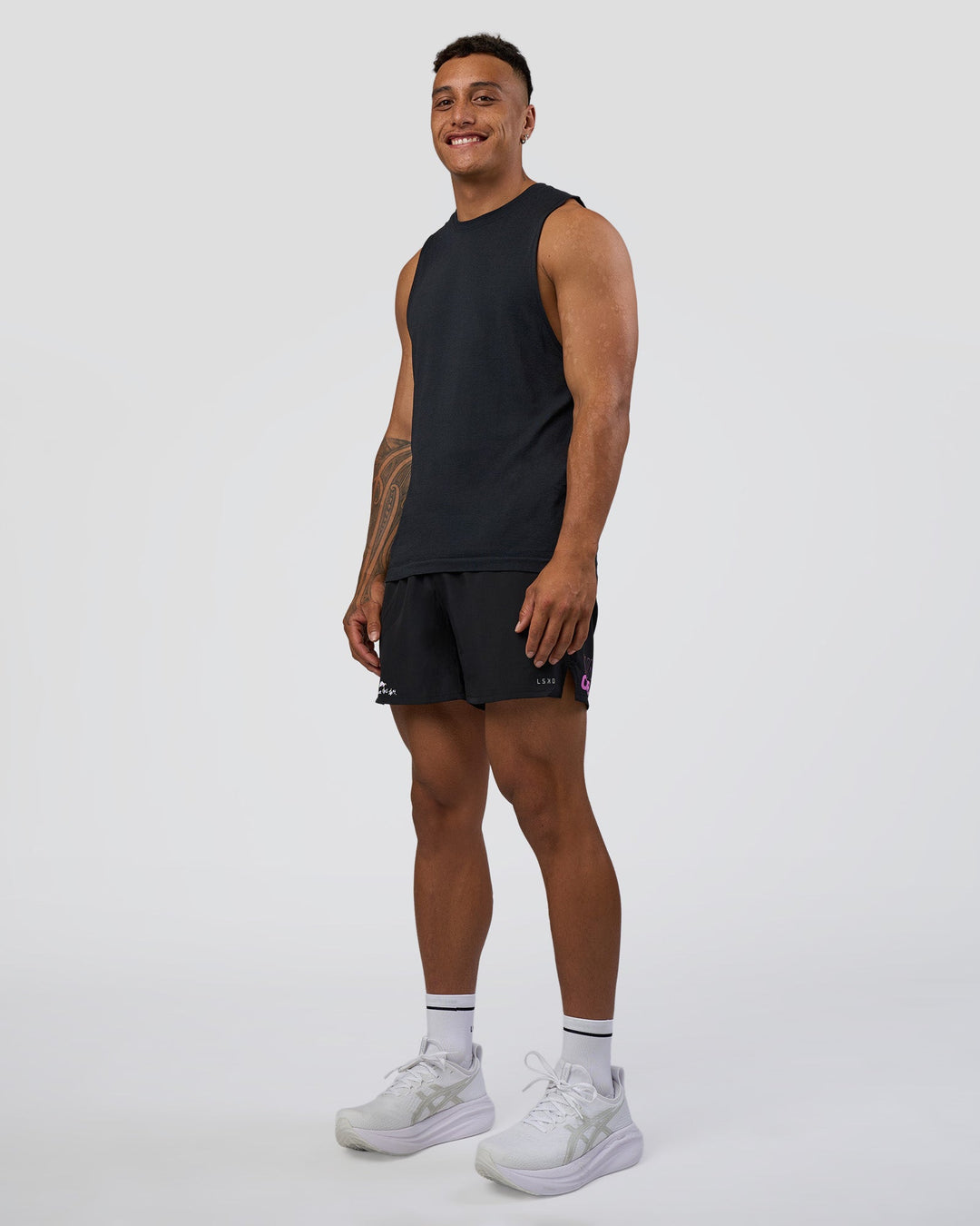 Man wearing Pace 5" Lined Running Short - Black-Ultra Fuchsia | Model:Daarian | Size:M
