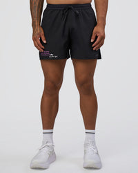Man wearing Pace 5" Lined Running Short - Black-Ultra Fuchsia | Model:Daarian | Size:M