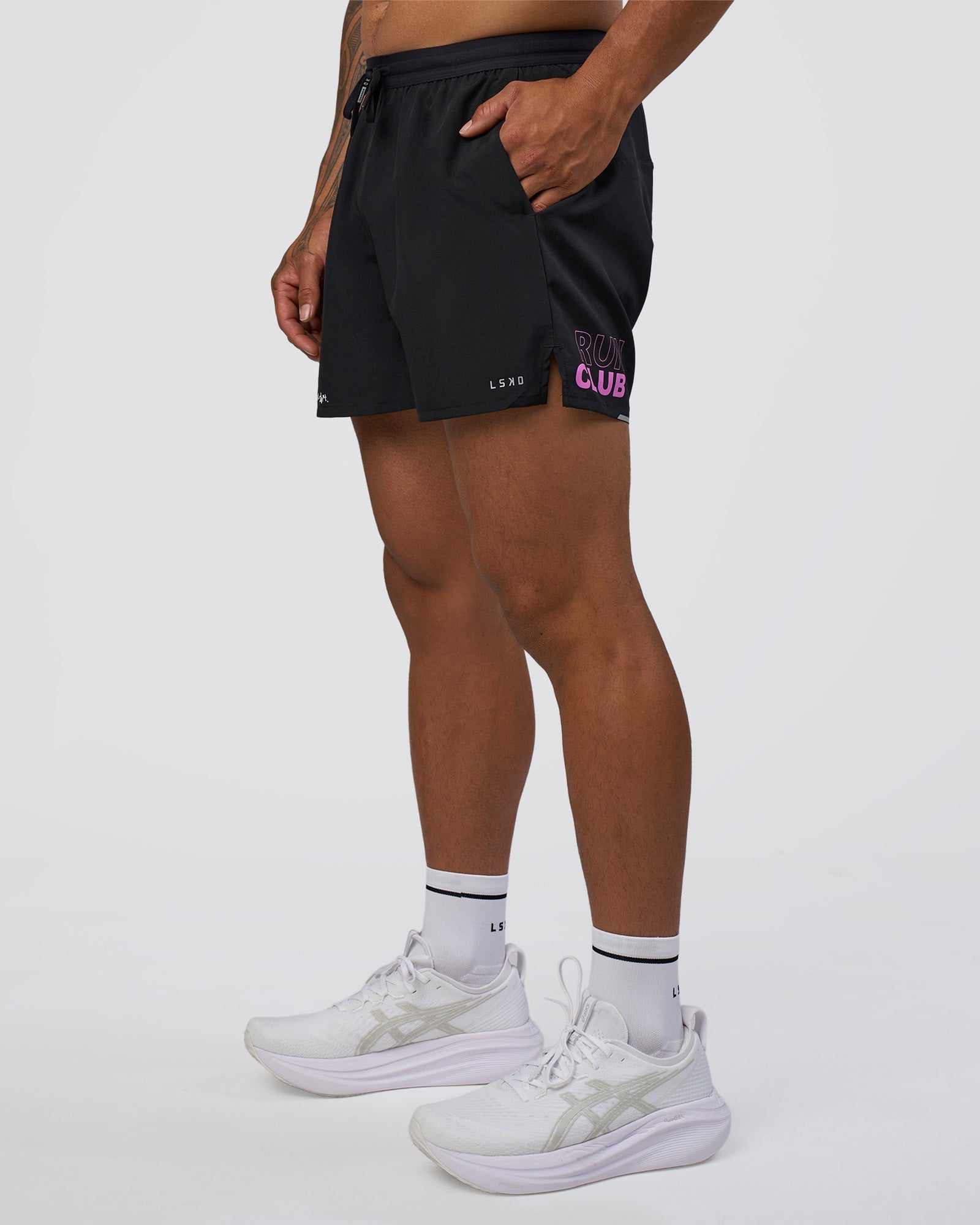 Man wearing Pace 5" Lined Running Short - Black-Ultra Fuchsia | Model:Daarian | Size:M