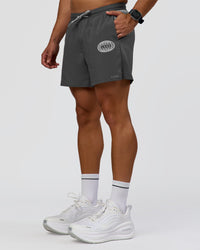 Man wearing Pace 5" Lined Running Short - Dark Storm-Alloy | Model:Jaiden | Size:M