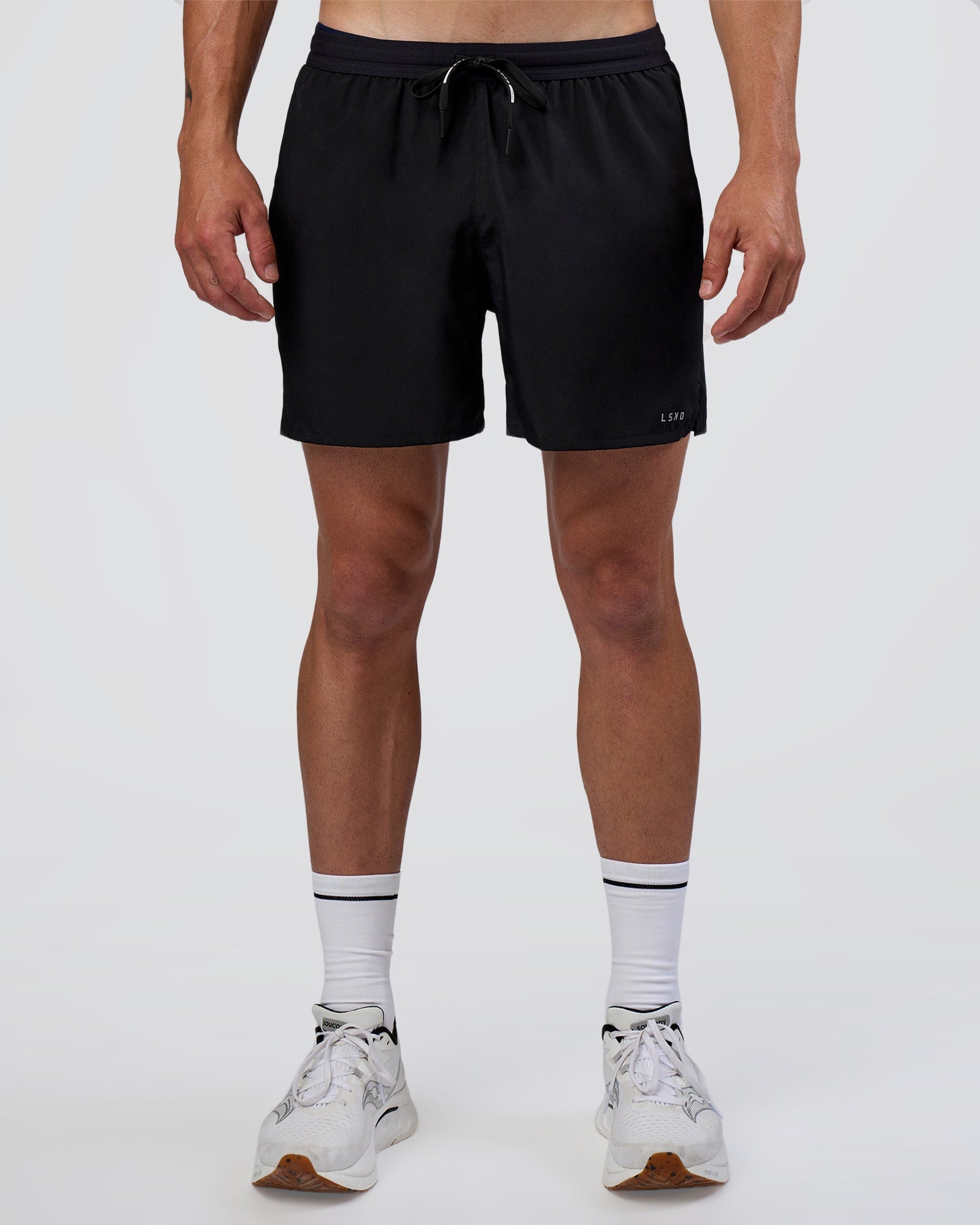 Man wearing Pace 5" Running Short - Black | Model:Konnor | Size:M