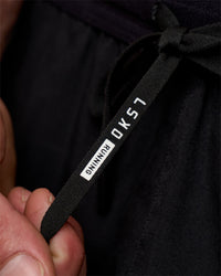 Man wearing Pace 5" Running Short - Black | Model:Konnor | Size:M