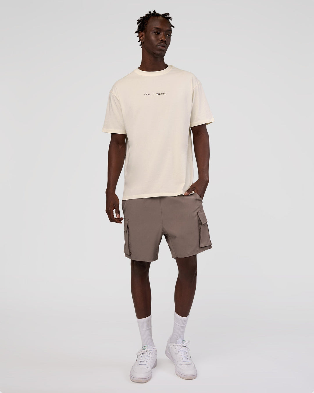Man wearing Peaches x LSKD Collection FLXCotton Oversize Tee - Off White | Model:Okello | Size:M