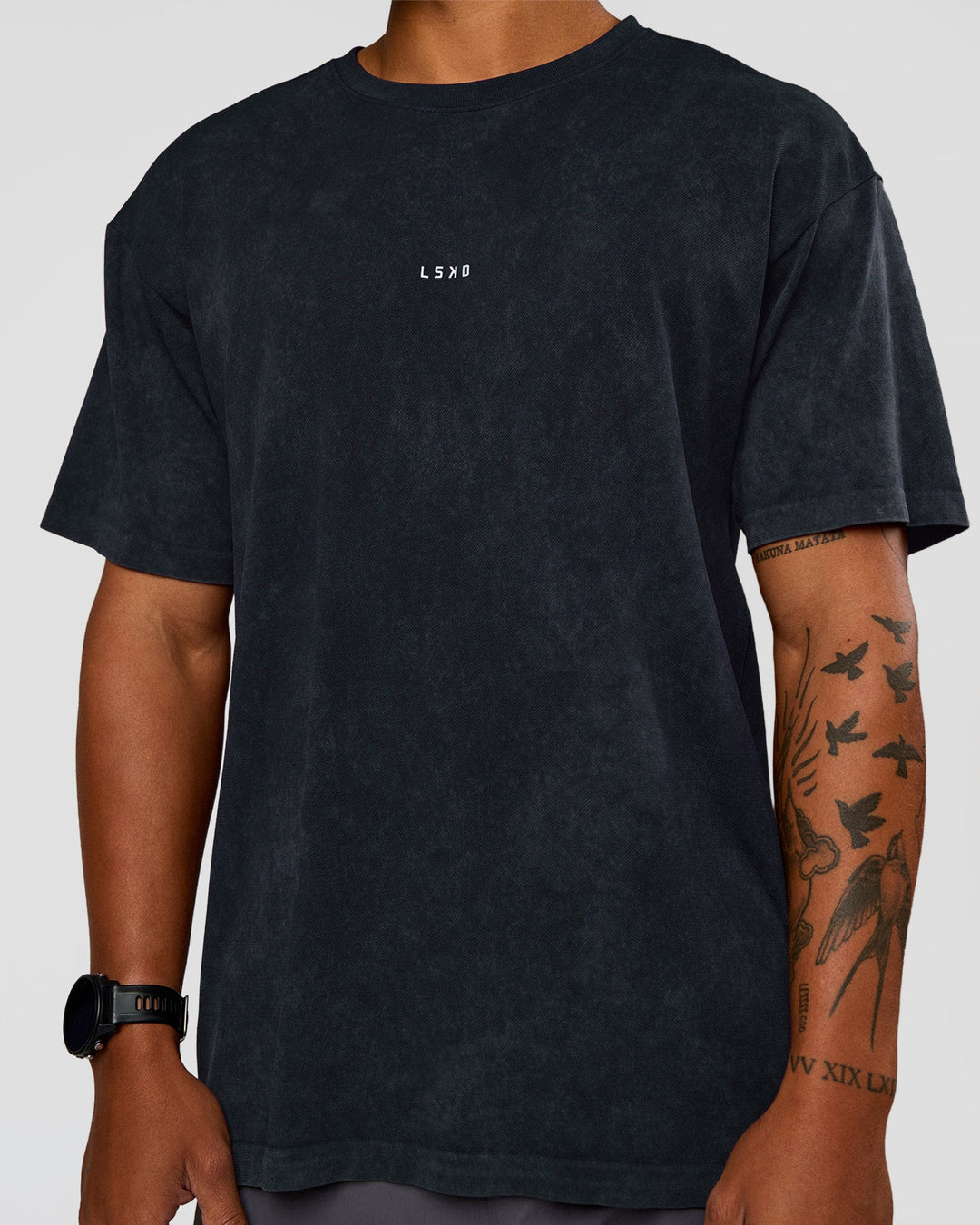 Man wearing Power Oversized Tee - Black Washed | Model:Malebo | Size:M