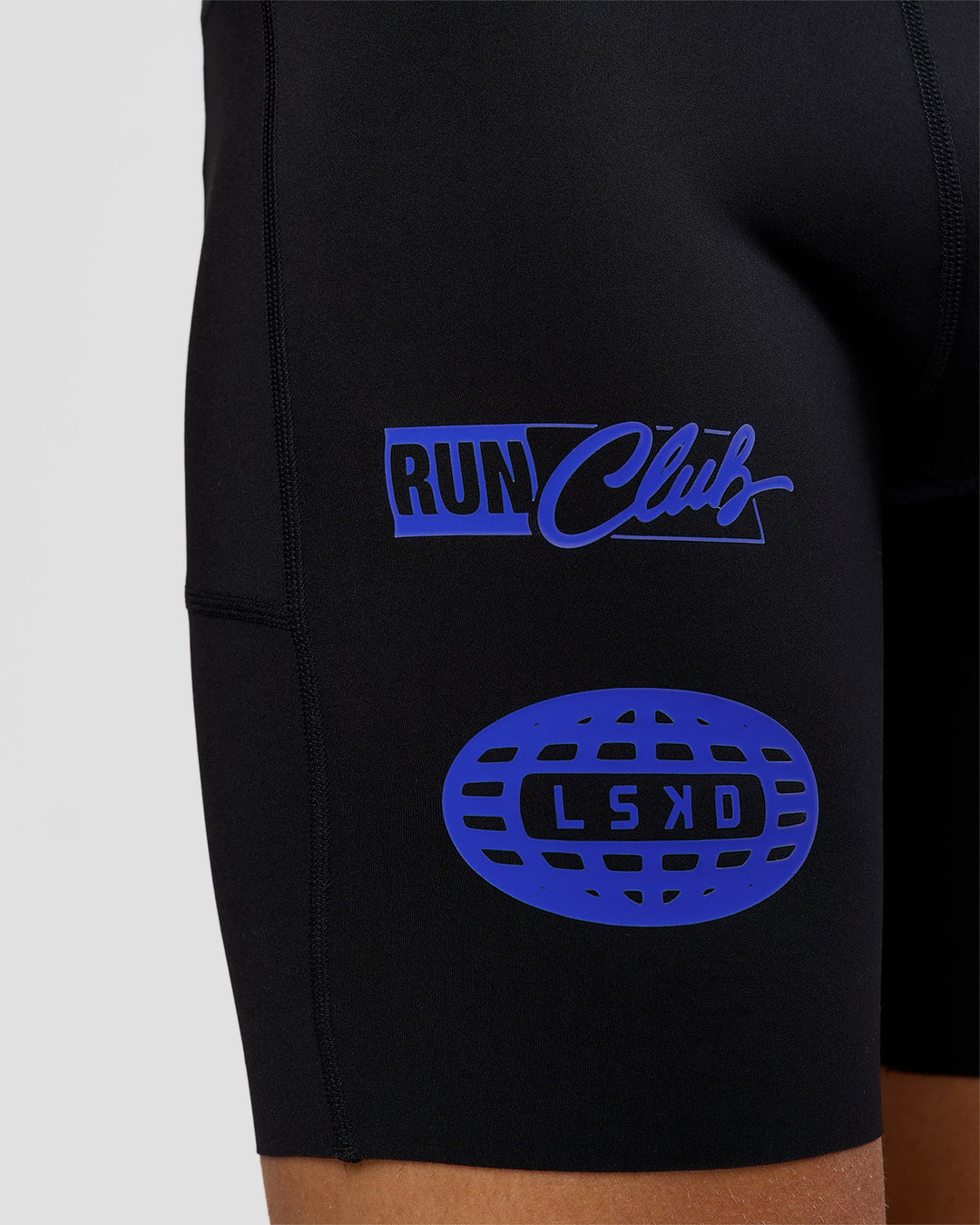 Man wearing Race Day 8" Short Tight - Black-Electric Indigo | Model:Albert | Size:M |
