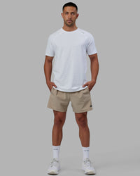 Man wearing Rep 5'' Performance Short - Taupe