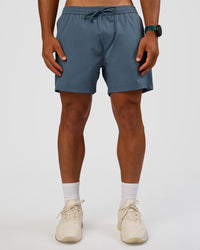 Man wearing Rep 5" Performance Short - Blue Mirage | Model:George | Size:M