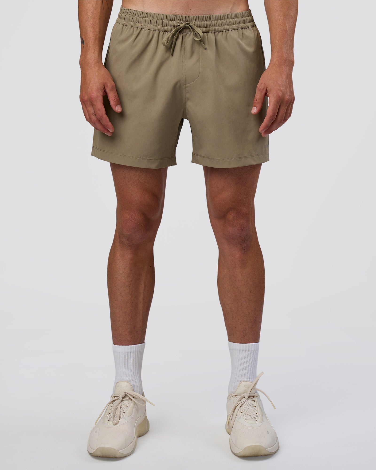 Man wearing Rep 5" Performance Short - Greige | Model:Konnor | Size:M