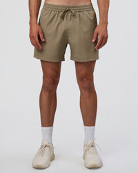 Man wearing Rep 5" Performance Short - Greige | Model:Konnor | Size:M