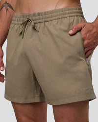 Man wearing Rep 5" Performance Short - Greige | Model:Konnor | Size:M