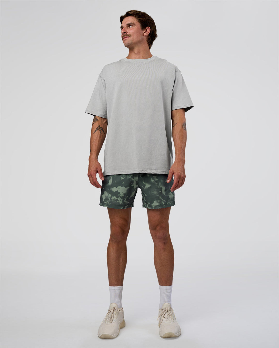 Man wearing Rep 5" Performance Short - Washed Camo Carbon | Model:Konnor | Size:M