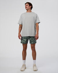 Man wearing Rep 5" Performance Short - Washed Camo Carbon | Model:Konnor | Size:M