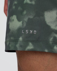 Man wearing Rep 5" Performance Short - Washed Camo Carbon | Model:Konnor | Size:M