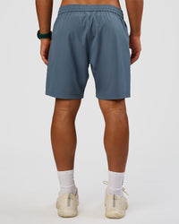 Man wearing Rep 7'' Performance Short - Blue Mirage | Model:George | Size:M