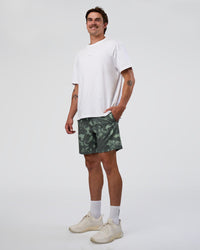 Man wearing Rep 7'' Performance Short - Washed Camo Carbon | Model:Konnor | Size:M
