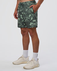 Man wearing Rep 7'' Performance Short - Washed Camo Carbon | Model:Konnor | Size:M